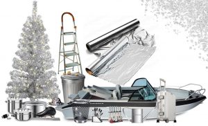 Aluminum Christmas tree surrounded by aluminum items such as a boat, cookware, ladder, aluminum foil