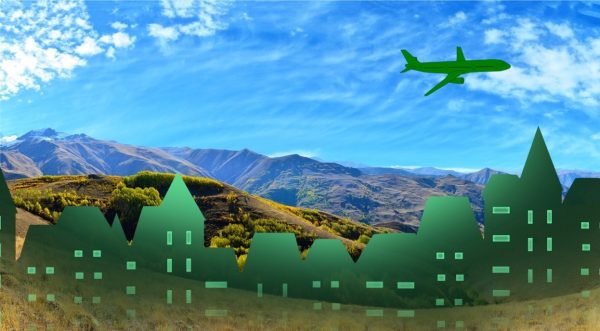 Beautiful country side with grassy mountain vistas and artistically-styled green cityscape & airplane