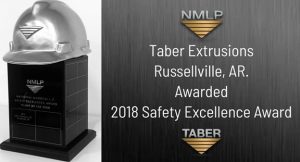 A 2-panel graphic – right panel is a wide shot of an elegant rectangular black lacquer pedestal adorned with a silver cast hard hat with the NMLP inverted triangle logo with words inscribed. The left panel reads, “Taber Extrusions Russellville, AR. Awarded 2018 Safety Excellence Award.”