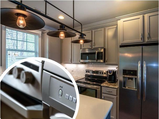 A beautiful modern kitchen with a metallic fridge, gas range, and microwave oven. There are metallic lamps on the ceiling and a circular-shaped insert photo of a close-up of a gas range’s controls and knobs.