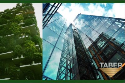 On the left is a picture of a multi-story building covered with luscious green plants and on the right is a tall modern building with glass walls exposing the aluminum and steel frame structure inside. On the bottom right is Taber Extrusion’s gold and silver logo.