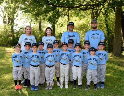 Taber Extrusions' Shae Bradley with young baseball team