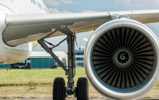 Detailed close-up of a jet engine turbine which highlights the complex engineering applications of hard alloy aluminum extrusions in aviation.