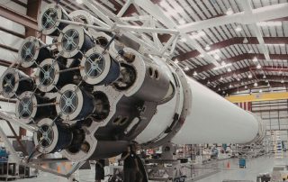 A large rocket structure in an assembly facility, showing one of the many the applications of aluminum extrusions in aerospace.