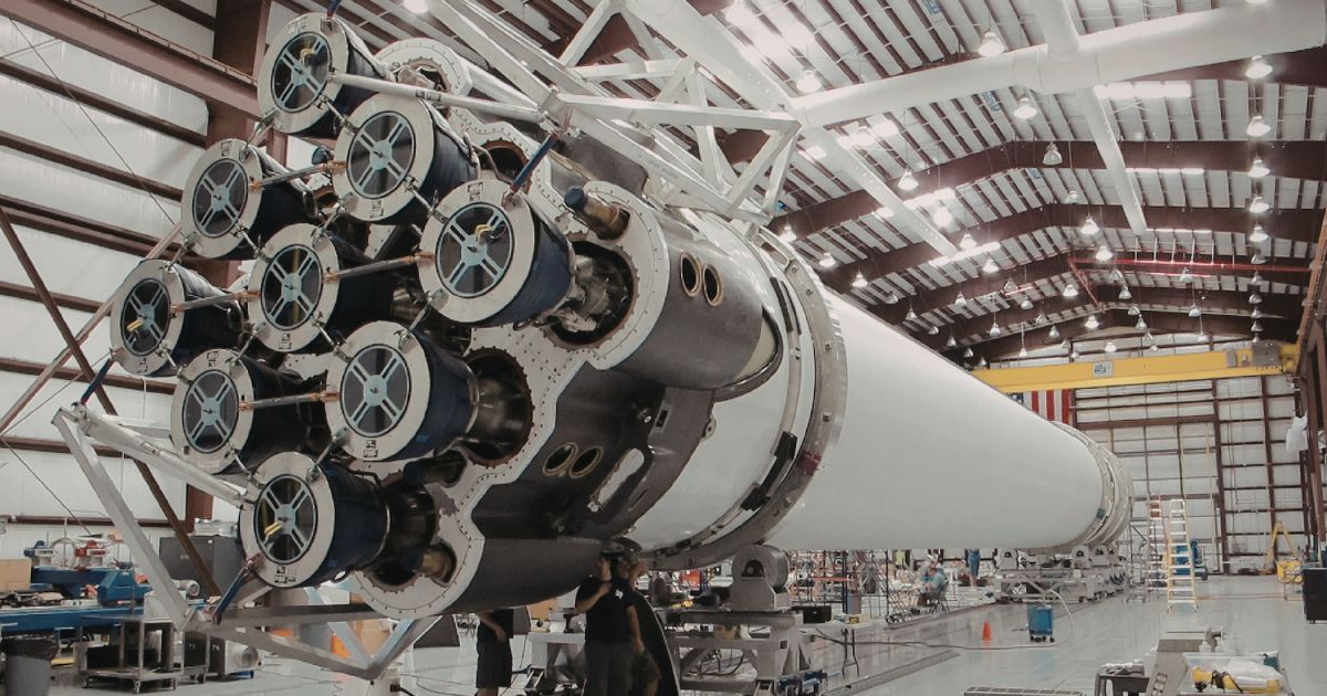 Taber-2026-08-aerospace-aluminum-extrusion-design-guide A large rocket structure in an assembly facility, showing one of the many the applications of aluminum extrusions in aerospace.